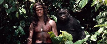 Movie still from “Greystoke: The Legend of Tarzan, Lord of the Apes” (1984), directed by Hugh Hudson – A man and a gorilla in the jungle; Medium shot, Low angle