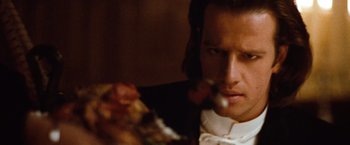Movie still from “Greystoke: The Legend of Tarzan, Lord of the Apes” (1984), directed by Hugh Hudson – A person eating food; Close Up shot, Over the shoulder angle