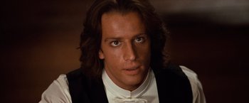Movie still from “Greystoke: The Legend of Tarzan, Lord of the Apes” (1984), directed by Hugh Hudson – A person wearing a suit and tie; Close Up shot, Low angle