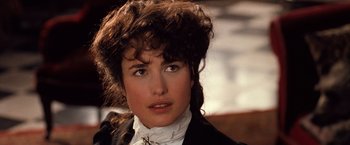 Movie still from “Greystoke: The Legend of Tarzan, Lord of the Apes” (1984), directed by Hugh Hudson – A person wearing a suit and tie; Close Up shot, Over the shoulder angle