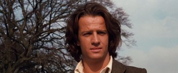 Movie still from “Greystoke: The Legend of Tarzan, Lord of the Apes” (1984), directed by Hugh Hudson – A person with long hair; Close Up shot, Low angle