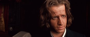 Movie still from “Greystoke: The Legend of Tarzan, Lord of the Apes” (1984), directed by Hugh Hudson – A person with long hair; Close Up shot, Over the shoulder angle