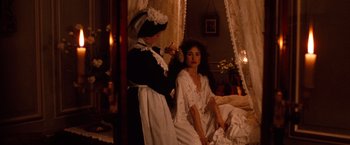 Movie still from “Greystoke: The Legend of Tarzan, Lord of the Apes” (1984), directed by Hugh Hudson – Two women dressed in old fashioned clothing , one of which has a hairbrush in her hair; Medium shot, High angle