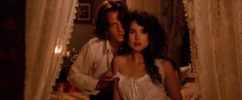 Movie still from “Greystoke: The Legend of Tarzan, Lord of the Apes” (1984), directed by Hugh Hudson – A man and a woman sitting on a bed; Close Up shot, High angle