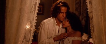 Movie still from “Greystoke: The Legend of Tarzan, Lord of the Apes” (1984), directed by Hugh Hudson – A man and a woman standing next to each other in a room; Close Up shot, Low angle