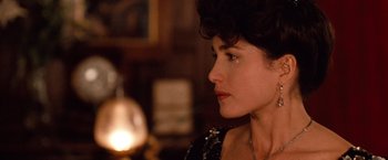 Movie still from “Greystoke: The Legend of Tarzan, Lord of the Apes” (1984), directed by Hugh Hudson – A person wearing a necklace; Close Up shot, Over the shoulder angle