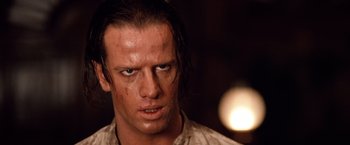 Movie still from “Greystoke: The Legend of Tarzan, Lord of the Apes” (1984), directed by Hugh Hudson – A person wearing a shirt; Close Up shot, Low angle