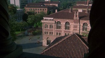 Movie still from “Gross Anatomy” (1989), directed by Thom Eberhardt – An aerial view of an old building with red tile roofs; Extreme Wide shot, High angle