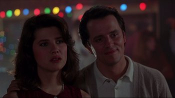 Movie still from “Gross Anatomy” (1989), directed by Thom Eberhardt – A man and a woman standing next to each other; Close Up shot, Low angle