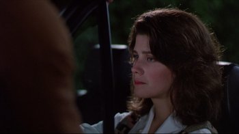 Movie still from “Gross Anatomy” (1989), directed by Thom Eberhardt – A person sitting in a car; Close Up shot, Over the shoulder angle