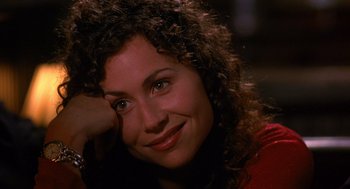 Movie still from “Grosse Pointe Blank” (1997), directed by George Armitage – A person with curly brown hair; Close Up shot, High angle