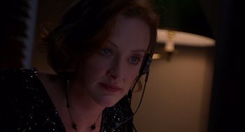 Movie still from “Grosse Pointe Blank” (1997), directed by George Armitage – A person wearing a headset; Close Up shot, Low angle