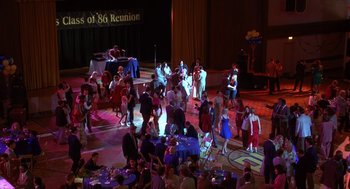 Movie still from “Grosse Pointe Blank” (1997), directed by George Armitage – A group of people standing on a dance floor; Extreme Wide shot, High angle