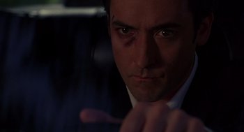 Movie still from “Grosse Pointe Blank” (1997), directed by George Armitage – A person with a black eye; Close Up shot, Low angle