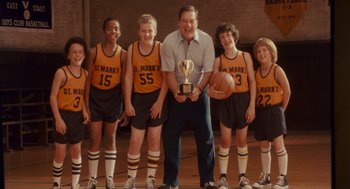 Movie still from “Grown Ups” (2010), directed by Dennis Dugan – A group of young boys holding a trophy and posing for a picture; Medium shot, Low angle