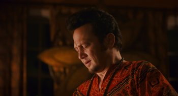 Movie still from “Grown Ups” (2010), directed by Dennis Dugan – A man in a red and orange shirt is looking down; Close Up shot, Low angle