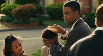 Movie still from “Grown Ups” (2010), directed by Dennis Dugan – Two men sitting on the side of the road brushing their hair; Close Up shot, Over the shoulder angle