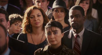 Movie still from “Grown Ups” (2010), directed by Dennis Dugan – A group of people standing in a room; Close Up shot, Over the shoulder angle