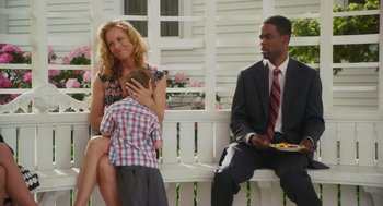Movie still from “Grown Ups” (2010), directed by Dennis Dugan – A man and a woman sitting on a bench with a child; Medium shot, Over the shoulder angle