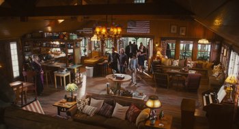 Movie still from “Grown Ups” (2010), directed by Dennis Dugan – People are gathered in a living room and dining room; Wide shot, High angle