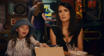 Movie still from “Grown Ups” (2010), directed by Dennis Dugan – A woman sitting next to a little girl at a table; Medium shot, Over the shoulder angle