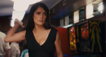 Movie still from “Grown Ups” (2010), directed by Dennis Dugan – A woman in a black dress is standing in a room; Close Up shot, Over the shoulder angle