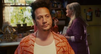 Movie still from “Grown Ups” (2010), directed by Dennis Dugan – A man with a messy hair style in front of a woman; Close Up shot, Over the shoulder angle