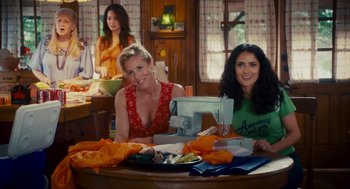 Movie still from “Grown Ups” (2010), directed by Dennis Dugan – A group of women sitting at a table with a sewing machine; Medium shot, Over the shoulder angle
