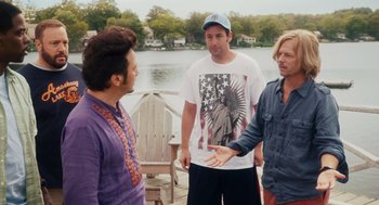 Movie still from “Grown Ups” (2010), directed by Dennis Dugan – Three men standing next to each other near a body of water; Medium shot, Over the shoulder angle