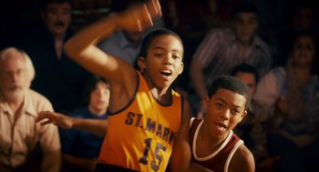 Movie still from “Grown Ups” (2010), directed by Dennis Dugan – Two young men are playing a game of basketball; Close Up shot, High angle