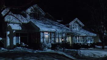 Movie still from “Grumpy Old Men” (1993), directed by Donald Petrie – A house that is lit up at night time; Extreme Wide shot, Low angle