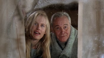 Movie still from “Grumpy Old Men” (1993), directed by Donald Petrie – A man and a woman standing next to each other; Close Up shot, Low angle