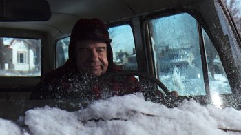 Movie still from “Grumpy Old Men” (1993), directed by Donald Petrie – A man driving a car in the snow; Close Up shot, Over the shoulder angle