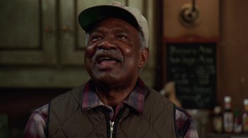 Movie still from “Grumpy Old Men” (1993), directed by Donald Petrie – An older man wearing a cap and a vest; Close Up shot, Low angle