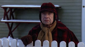 Movie still from “Grumpy Old Men” (1993), directed by Donald Petrie – An older man wearing a hat and a scarf; Medium shot, Over the shoulder angle