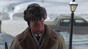 Movie still from “Grumpy Old Men” (1993), directed by Donald Petrie – An older man wearing a fur hat and glasses; Close Up shot, Over the shoulder angle