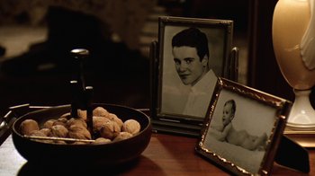 Movie still from “Grumpy Old Men” (1993), directed by Donald Petrie – A bowl of food and a picture of a young boy; Extreme Close Up shot, High angle