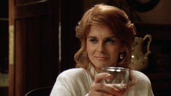 Movie still from “Grumpy Old Men” (1993), directed by Donald Petrie – A person holding a wine glass; Close Up shot, Over the shoulder angle