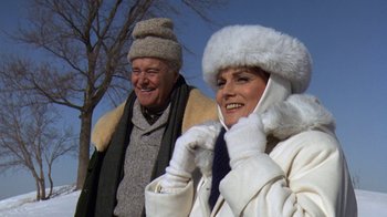 Movie still from “Grumpy Old Men” (1993), directed by Donald Petrie – A man and a woman wearing winter clothing; Medium shot, Low angle