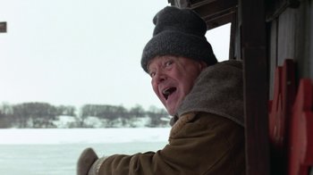 Movie still from “Grumpy Old Men” (1993), directed by Donald Petrie – An older man wearing a winter coat and a hat; Close Up shot, Low angle