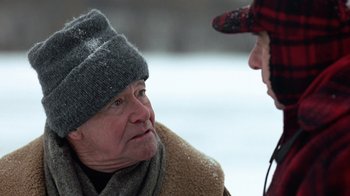 Movie still from “Grumpy Old Men” (1993), directed by Donald Petrie – A man wearing a hat and scarf talking to another man; Close Up shot, Over the shoulder angle