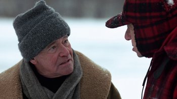 Movie still from “Grumpy Old Men” (1993), directed by Donald Petrie – A man wearing a hat and scarf talking to another man; Close Up shot, Over the shoulder angle