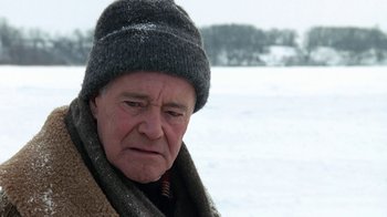 Movie still from “Grumpy Old Men” (1993), directed by Donald Petrie – An older man wearing a hat and scarf in the snow; Close Up shot, Over the shoulder angle