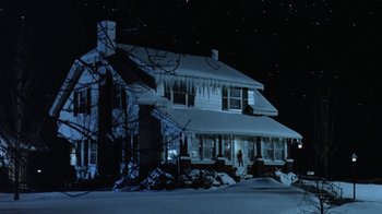 Movie still from “Grumpy Old Men” (1993), directed by Donald Petrie – A house that is covered in ice and snow; Extreme Wide shot, Low angle