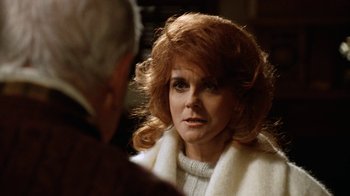 Movie still from “Grumpy Old Men” (1993), directed by Donald Petrie – An older woman wearing a white sweater and a white scarf; Close Up shot, Over the shoulder angle