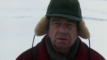 Movie still from “Grumpy Old Men” (1993), directed by Donald Petrie – An older man wearing a hat and a scarf; Close Up shot, Over the shoulder angle