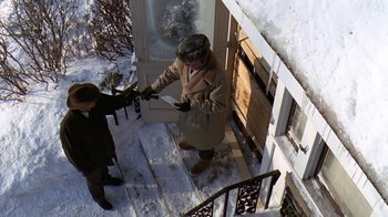 Movie still from “Grumpy Old Men” (1993), directed by Donald Petrie – A man and a woman opening the door of a house; Wide shot, Overhead angle