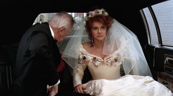 Movie still from “Grumpy Old Men” (1993), directed by Donald Petrie – An older man and a woman in a wedding dress; Medium shot, Over the shoulder angle
