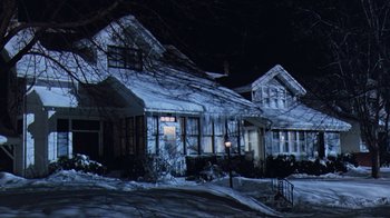 Movie still from “Grumpy Old Men” (1993), directed by Donald Petrie – A house that is covered in ice and snow; Extreme Wide shot, Low angle