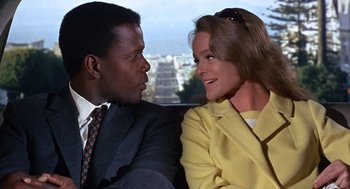 Movie still from “Guess Who's Coming to Dinner” (1967), directed by Stanley Kramer – A man and a woman sitting next to each other in front of a window; Close Up shot, Low angle